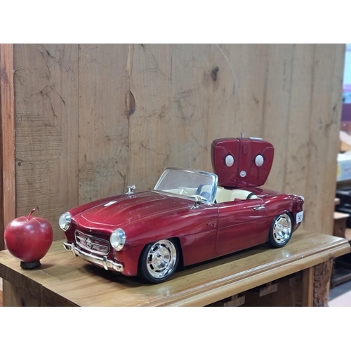 743 - A remote control Bratz Forever Diamondz MG MGA cruiser in a striking red finish. Battery operated.