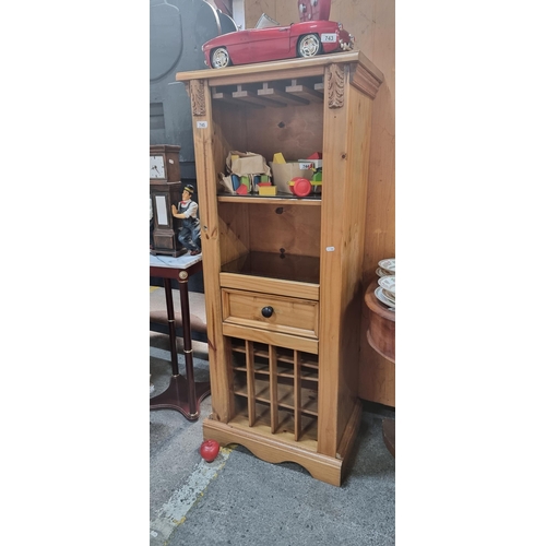 745 - A lovely solid Pine drinks cabinet with glasses holder at the top, drawer to centre and slotted wine... 