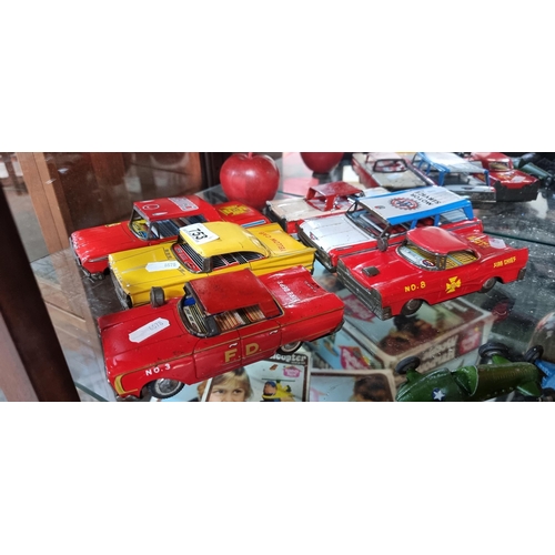 753 - Working friction tin plate collection model cars including a yellow taxi cab, chief of police car, f... 