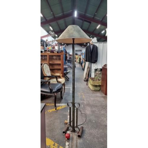 759 - A very unusual Irish wrought metal floor lamp with geometric design to base and a matching shade, al... 