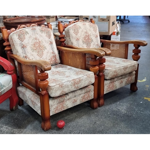 802 - A pair of vintage, solid wood deep-seat armchairs. With rattan detailing under the armrests. Upholst... 