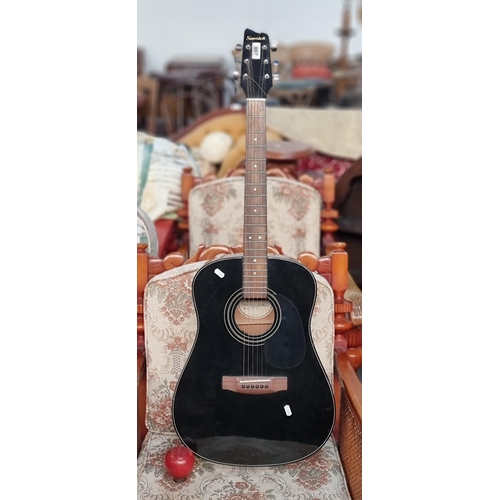 807 - A Samick branded acoustic guitar. In a glossy black finish. Model LW015G/BK. Internet comps - second... 