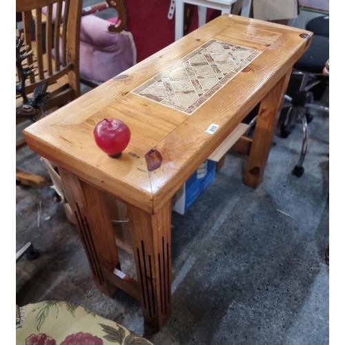 815 - A solid wood console table. With pink and cream stone inlay detailing to top. With reeded detail to ... 