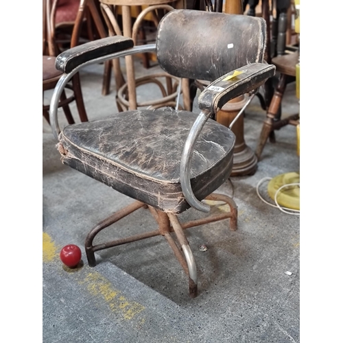 825 - A mid-century modern swivel chair with black leather upholstery and chrome base. Just absolutely lov... 