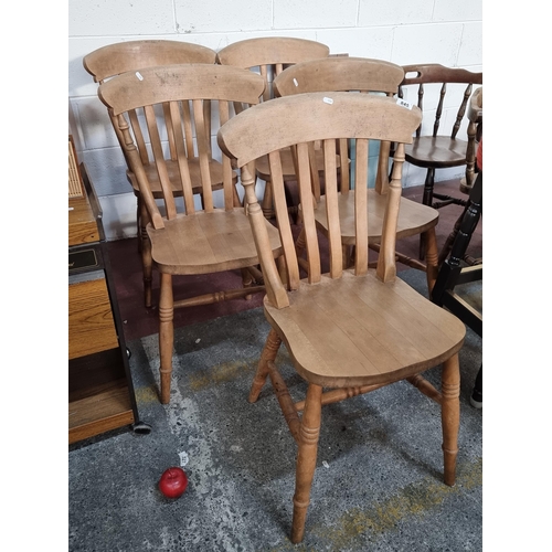 845 - Five wooden slat back dining chairs with turned wood legs.