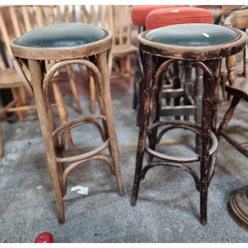 846 - Two vintage bar stools with bent wood base and upholstered in a green leather with stud detailing.