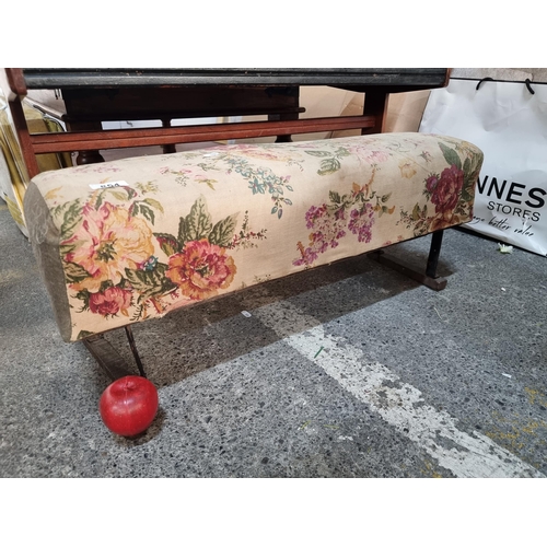 854 - A charming long vintage pommel  footstool with embroidered floral fabric to top. very comfortable to... 