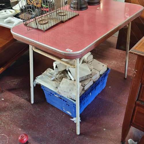 875 - A super retro, very cool red Formica topped table with cream metal base.