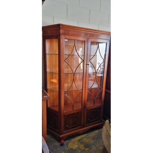 896 - Star lot :A impressive display cabinet with beautiful astro-glazed doors to front, three glass and o... 