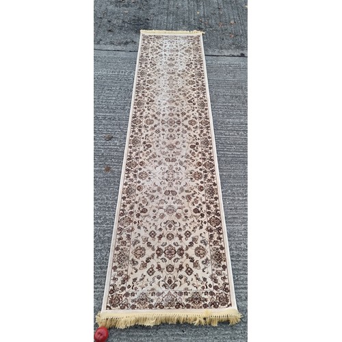 818 - Star lot: A nice Kashmiri hall runner rug in beige and brown shades, with fringe trim. W77cm x L315c... 