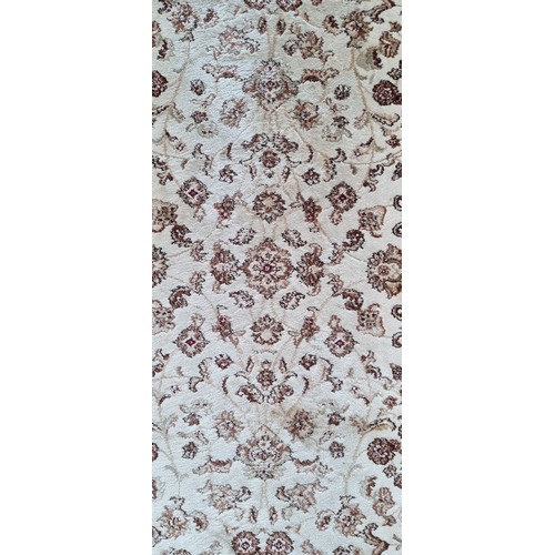 818 - Star lot: A nice Kashmiri hall runner rug in beige and brown shades, with fringe trim. W77cm x L315c... 