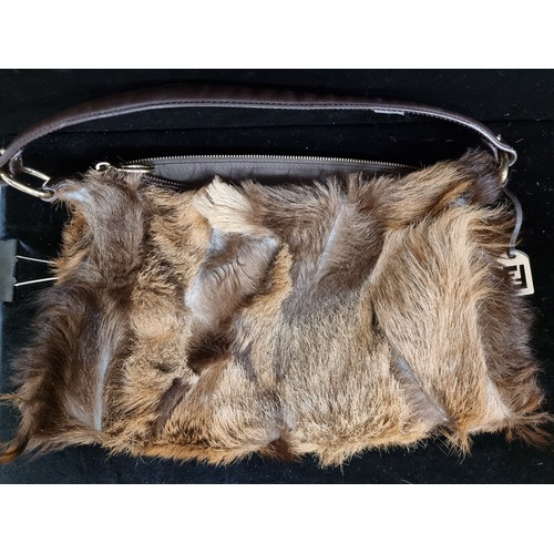 194 - Star Lot : A genuine fur nappa leather handbag by designer brand Fendi. Made in Italy with branded b... 