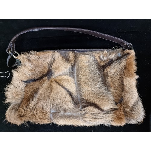 194 - Star Lot : A genuine fur nappa leather handbag by designer brand Fendi. Made in Italy with branded b... 