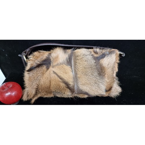 194 - Star Lot : A genuine fur nappa leather handbag by designer brand Fendi. Made in Italy with branded b... 