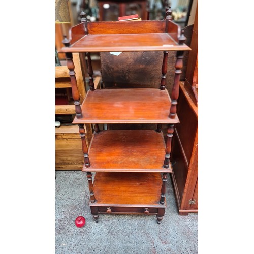 662 - A fantastic Victorian four tier dumb waiter, with drawer to base, gallery back, baluster supports an... 