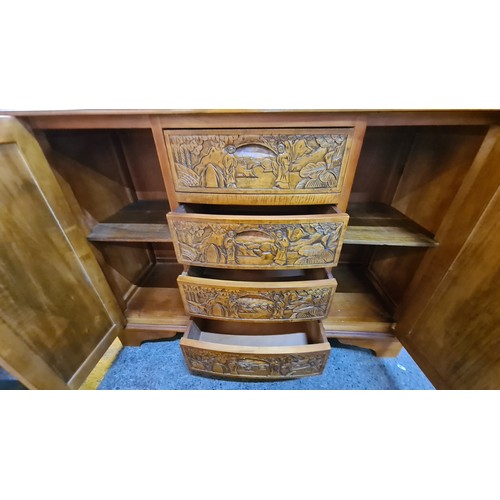 679 - Star lot : A fabulous Chinese Rosewood credenza with four drawers to front flanked by two cupboards ... 