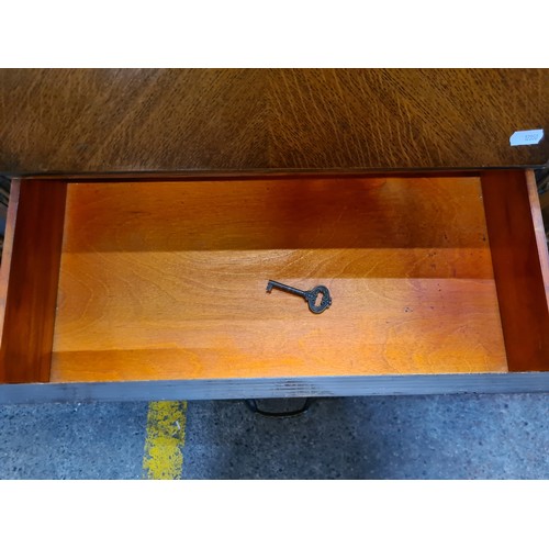 680 - Star lot : A fantastic Art Deco writing table with two astroglazed display cabinets to each side wit... 