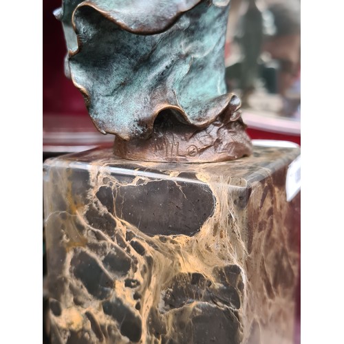 713 - Star lot : A very heavy solid bronze figurative sculpture of a woman, her verdigris dress blowing dr... 