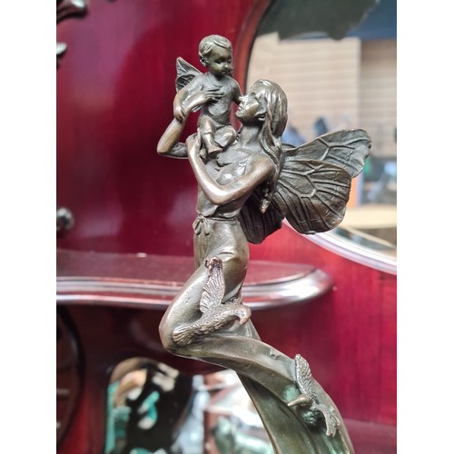 715 - Star lot : A heavy cast bronze  sculpture of a fairy embracing a fae child. Lovely casting, really n... 