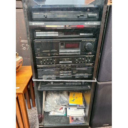 721 - A vintage, Pioneer branded Music Centre. Including Turntable, FM/AM Digital Synthesiser Tuner (model... 