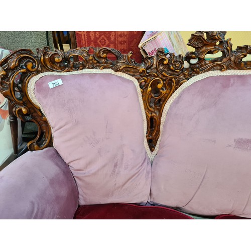 793 - Star lot : A very striking three-seater sofa with a lavishly carved frame in high relief with a glos... 