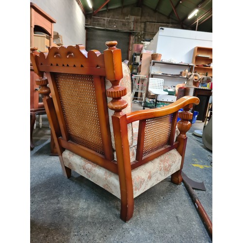 802 - A pair of vintage, solid wood deep-seat armchairs. With rattan detailing under the armrests. Upholst... 