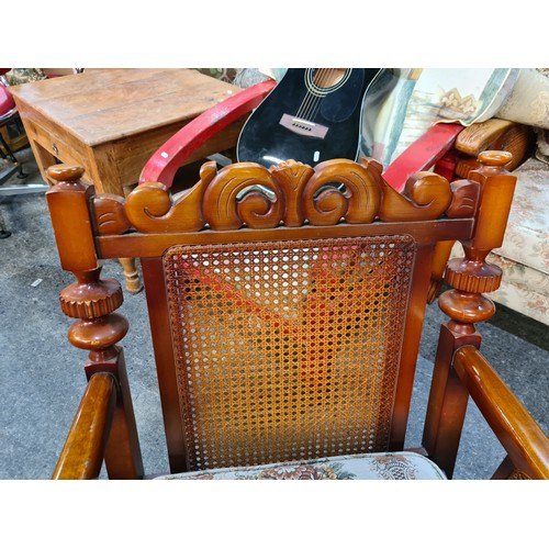 802 - A pair of vintage, solid wood deep-seat armchairs. With rattan detailing under the armrests. Upholst... 