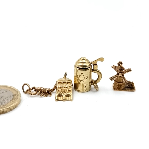 10 - A collection of four antique 9ct Gold charms, in the forms of a lidded Tankard, an articulated windm... 