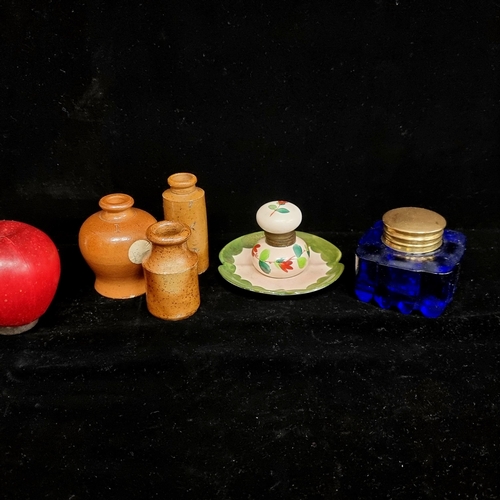 119 - A selection of five antique inkwells and bottles. Including a heavy Bristol blue glass example, thre... 