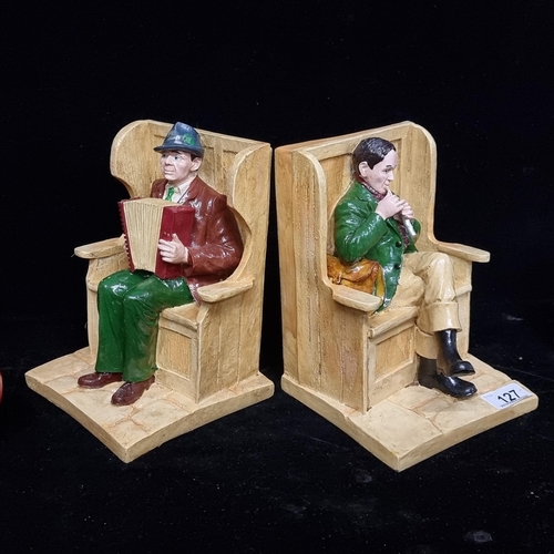 127 - A charming, figural pair of bookends. Featuring two Irish traditional musicians including a whistle ... 