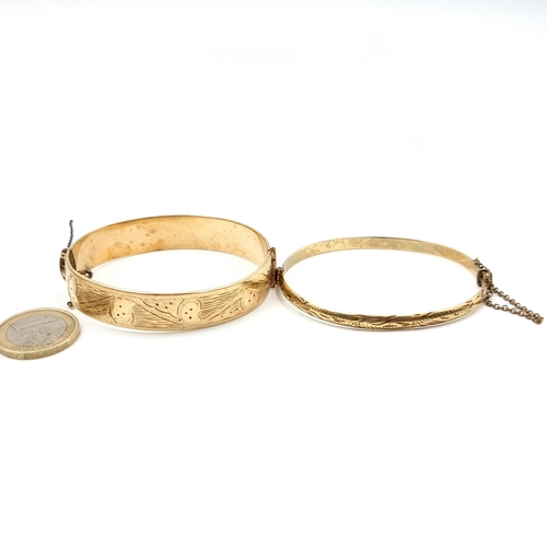 13 - Two antique 9 carat Gold bronze core bracelets, including a thick band example with beautiful intric... 