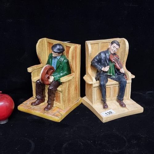 130 - A charming, figural pair of bookends. Featuring two Irish traditional musicians including a fiddle p... 