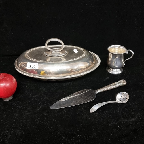 154 - A selection of four serving ware, including a lidded tureen , a cake knife, a tealeaf strainer and a... 