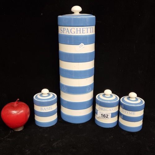 162 - A set of four ceramic lidded cannisters in a blue and white stripe, after Cornish ware. Designed by ... 