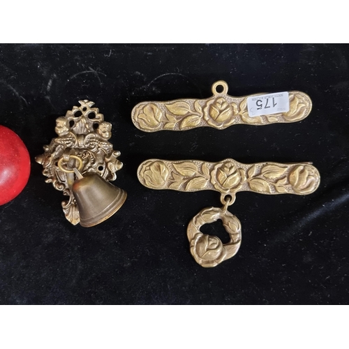 175 - A trio of vintage, brass items including a door knocker and a door bell.