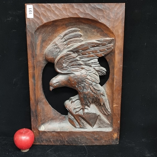 191 - An exceptionally heavy vintage carved wooden plaque depicting an eagle in hunting pose. A striking e... 