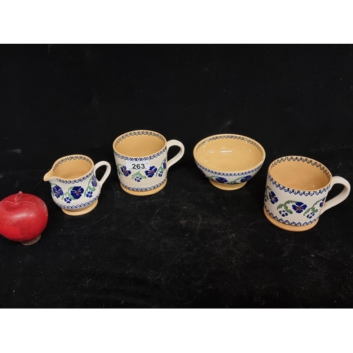 263 - A beautiful lot of four pottery items from Irish designer Nicholas Mosse, including two mugs, a milk... 