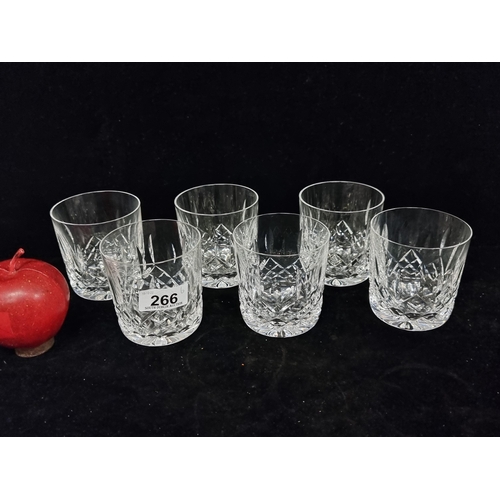 266 - A set of six cut crystal whiskey tumbler glasses by Waterford Crystal. In the Lismore pattern. Acid ... 