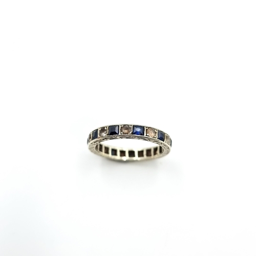 3 - A stunning antique 18 carat White Gold channel set full Eternity ring, set with an array of Sapphire... 