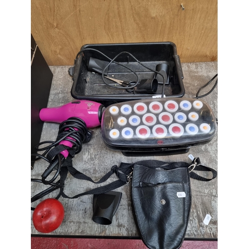 302 - A hairstyling lot including a full set of Ceramic Pulse hair rollers by BabylissPro, along with a Mi... 