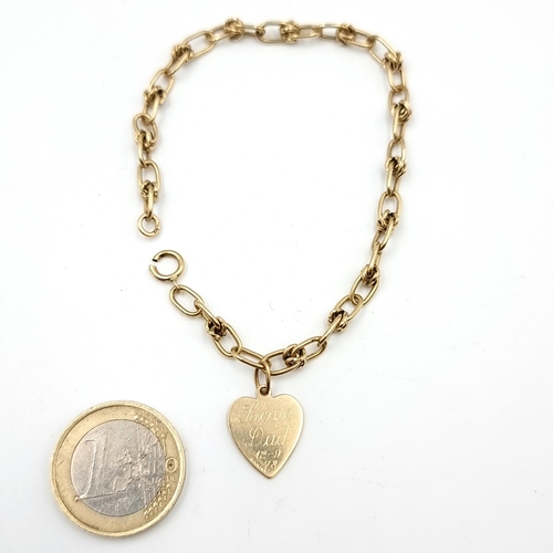 33 - A charming 9 carat Gold chain link bracelet, set with a love heart clasp and inscription 