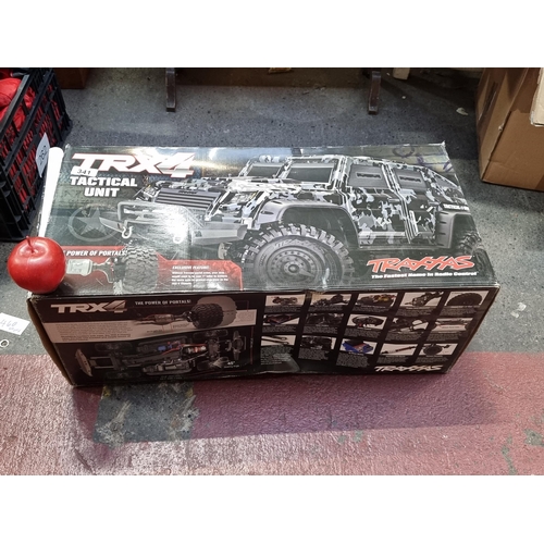 341 - Star Lot : A fantastic very large TRX4 Tactical Unit remote control car with a Traxxas controller. W... 