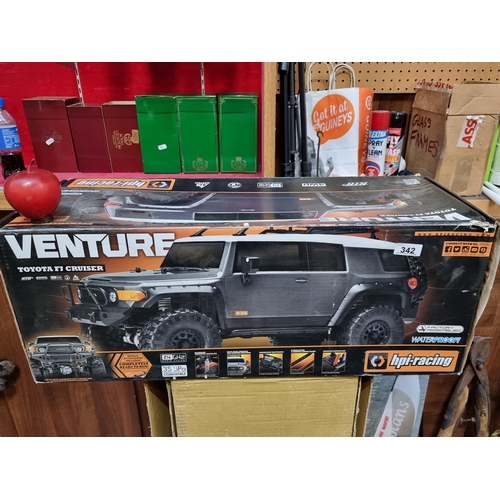 342 - Star Lot : A fantastic very large Venture Toyota FJ Cruiser remote control car from HPI.Racing. With... 