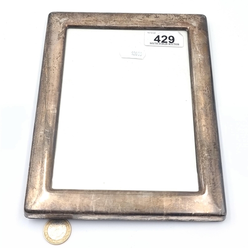 A large glazed Carrs of Sheffield vintage Sterling silver photo frame, with royal blue velvet back.