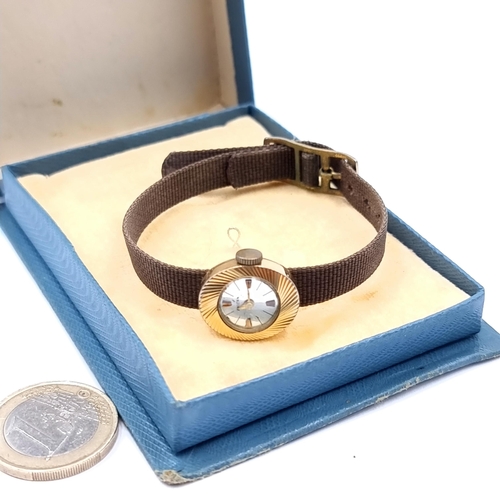 454 - A ladies vintage 9ct gold wrist watch by designer 