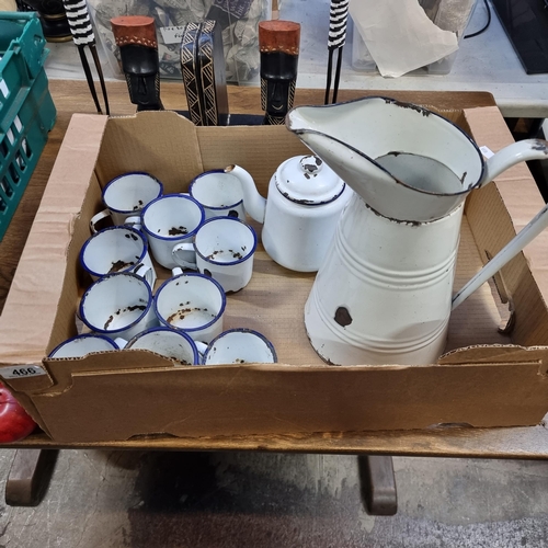 466 - A selection of twelve pieces of vintage enamel ware. A classic set consisting of cups, teapot and la... 