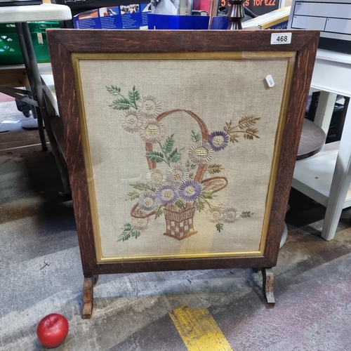 468 - An Edwardian fire screen featuring beautiful embroidered wild flower basket scene on a raw linen bac... 