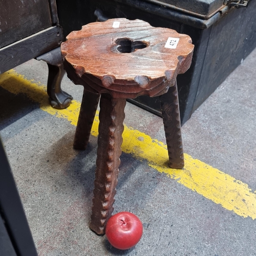 472 - A charming, vintage Irish wooden milking stool. Hand-carved with a trefoil pierced motif to seat and... 