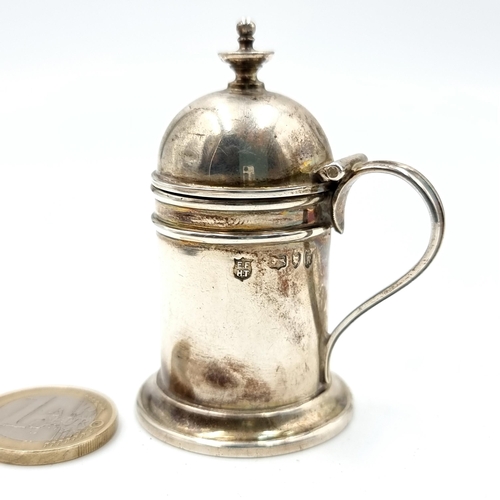 52 - A sterling silver Victorian dome and finial topped Mustard pot, with a nicely turned finish and a 