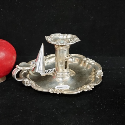 99 - An antique, EPNS chamber candle holder, With detachable candle snuffer. Featuring a ''rise and fall'... 